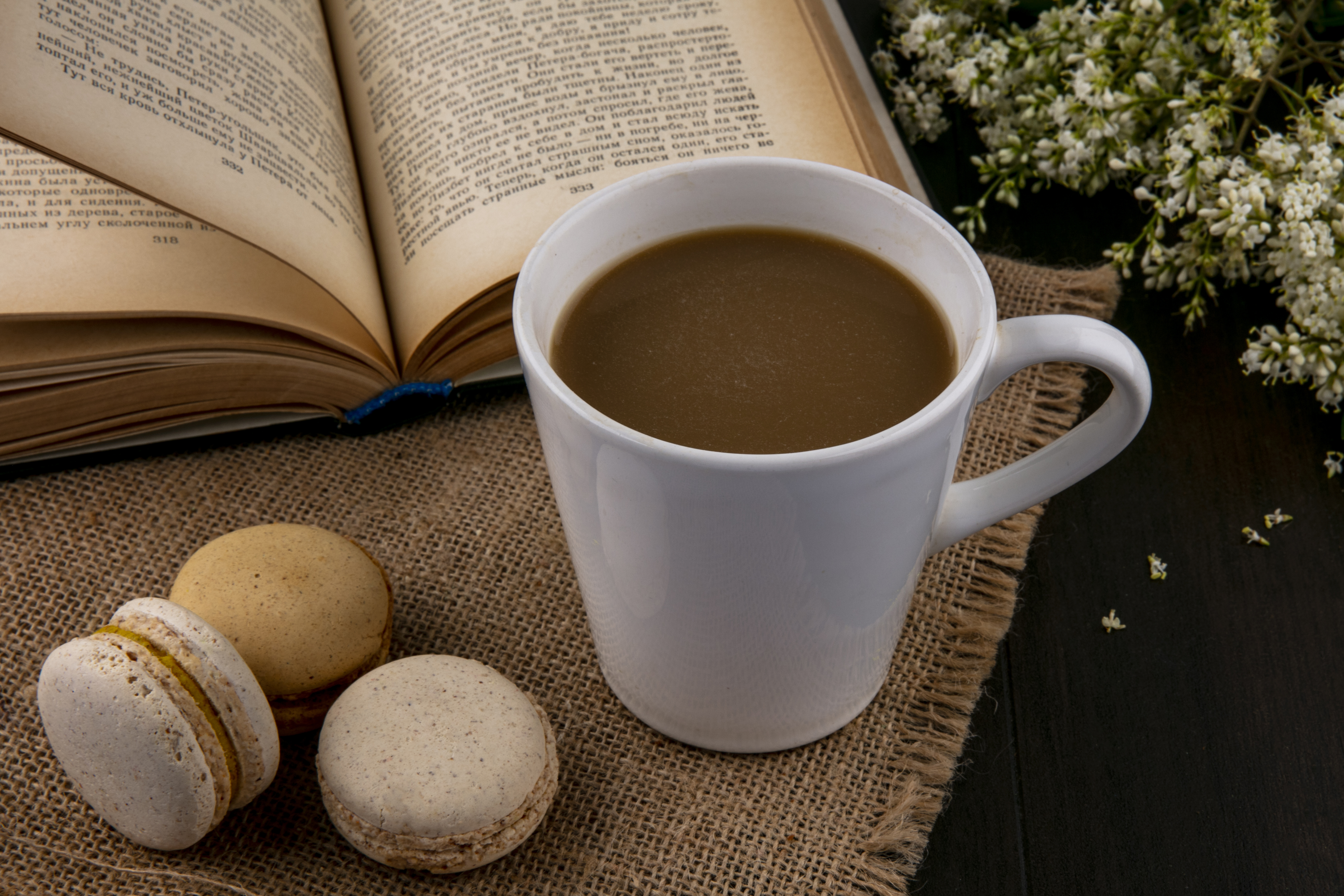 Macarons with coffee and flowers